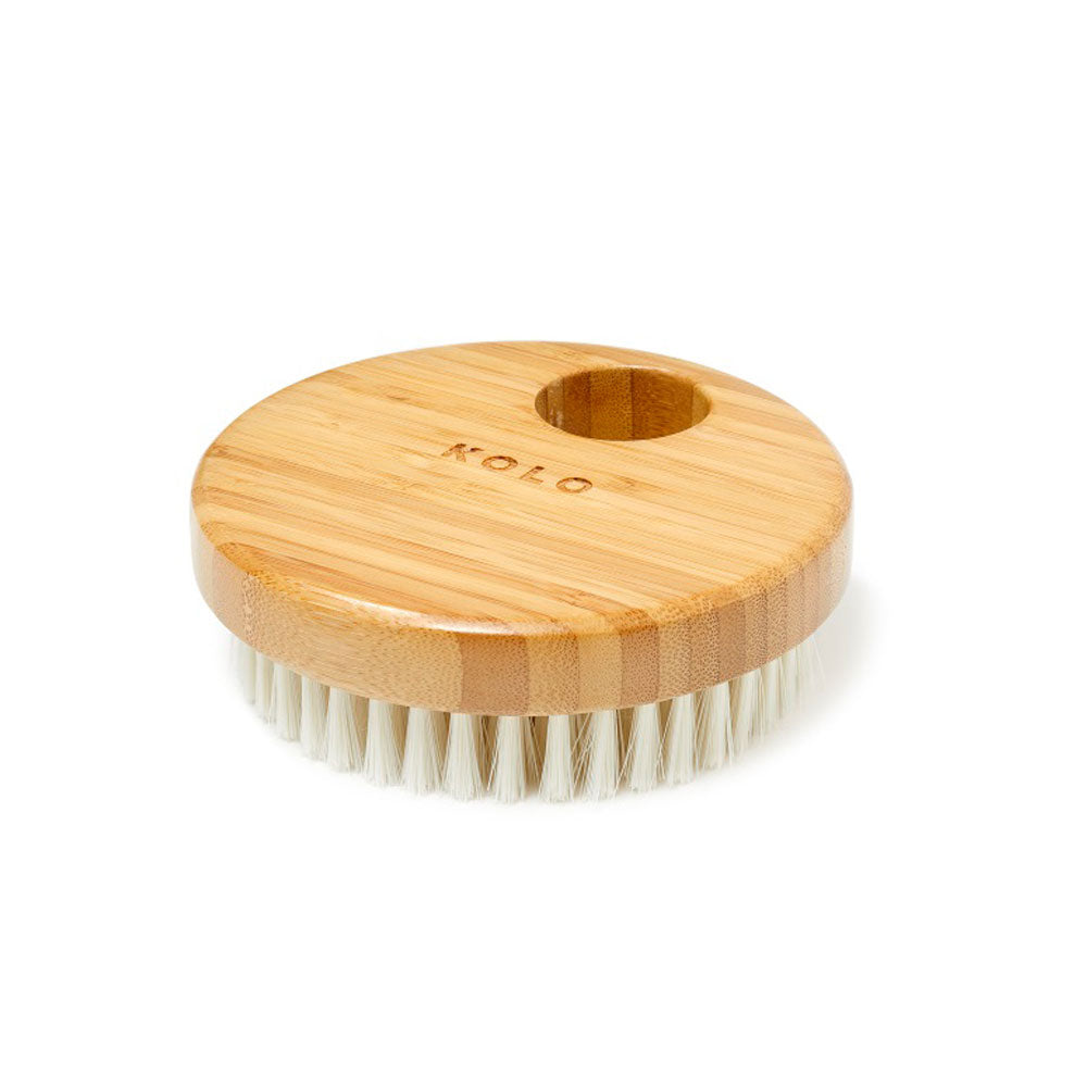 KOLO bamboo body brush with round wooden handle and soft white bristles for gentle exfoliation