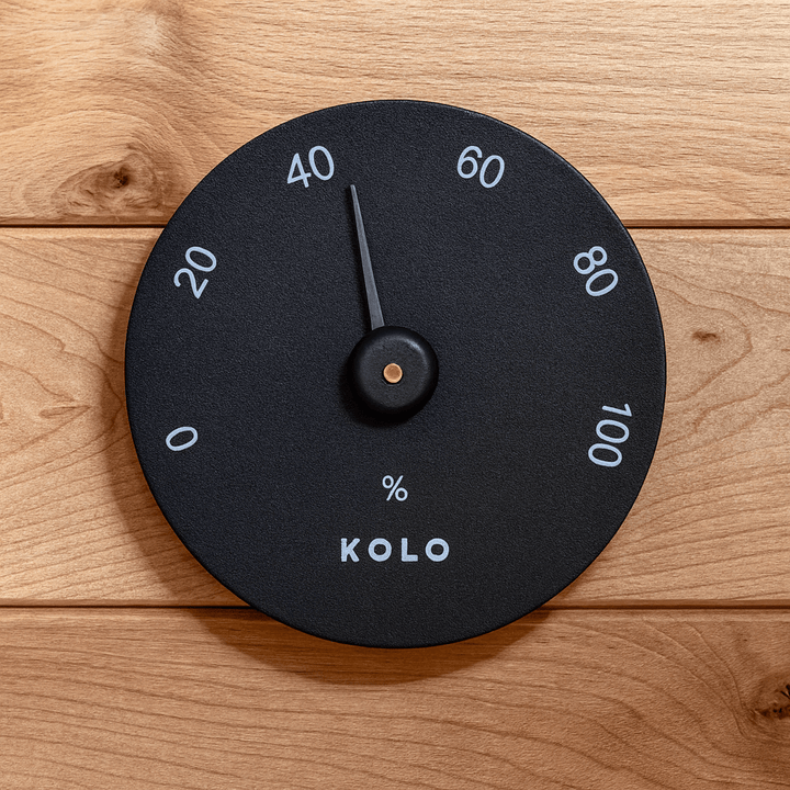 KOLO hygrometer for sauna displaying humidity levels on a sleek black design