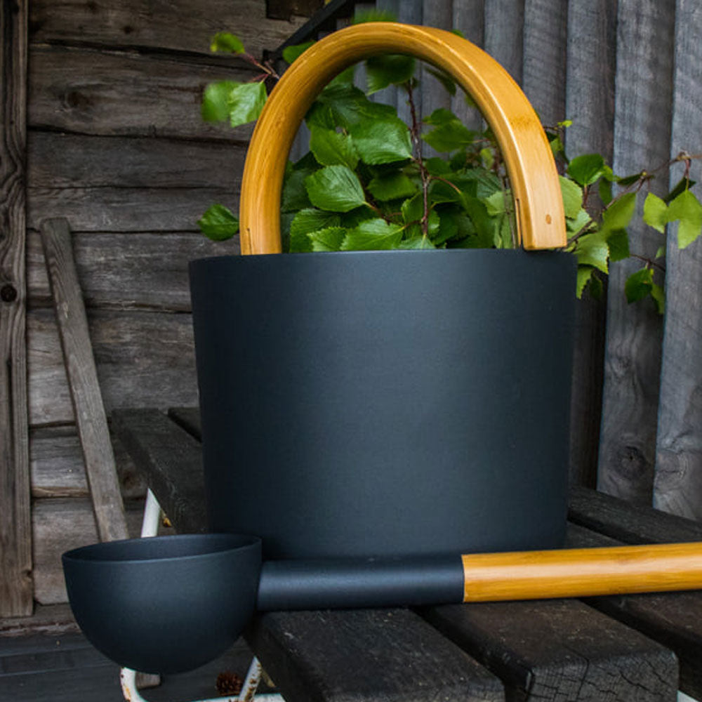 KOLO sauna accessories for home spa featuring black bucket with wooden handle and ladle
