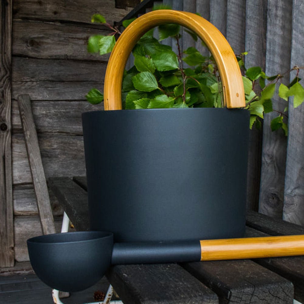 KOLO sauna accessories for home spa including a stylish black bucket with wooden handle and scoop