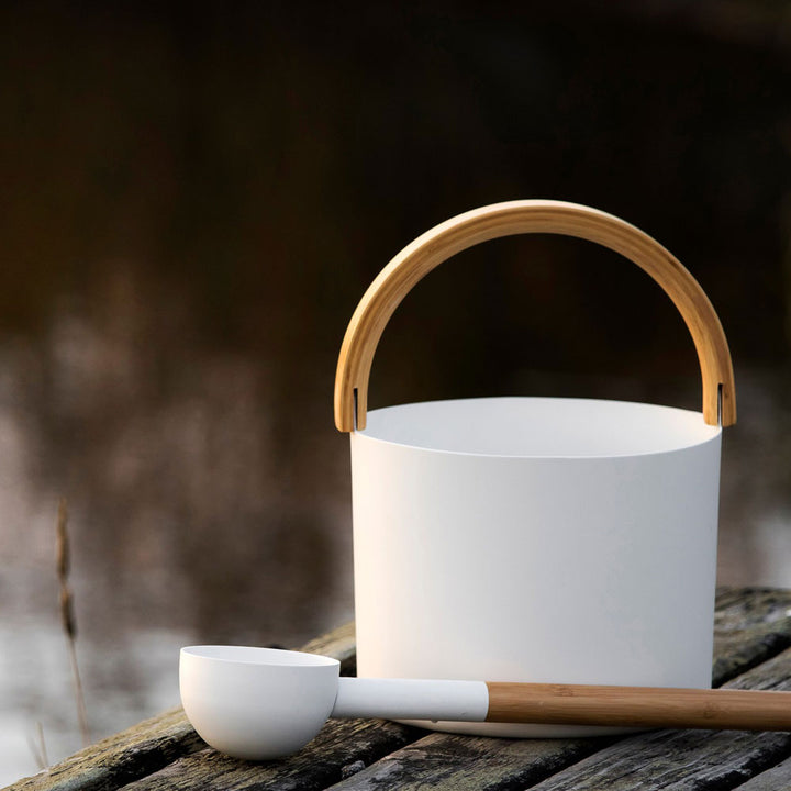 KOLO sauna accessories for home spa white bucket with wooden handle and matching ladle on wooden surface
