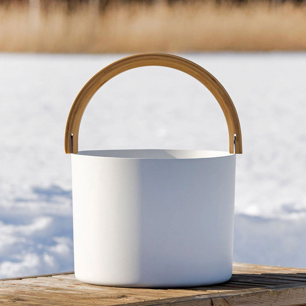 White sauna bucket with a wooden handle, part of KOLO sauna accessories for a stylish spa experience