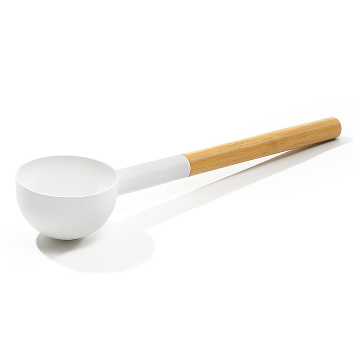 KOLO sauna ladle with wood handle featuring a white scoop and natural wood grip