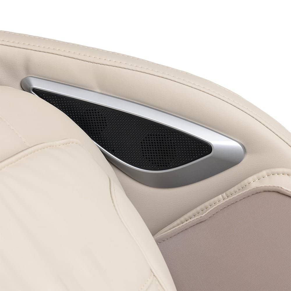 Close-up of the Kyota Joubu M880 massage chair's sleek speaker design in beige upholstery