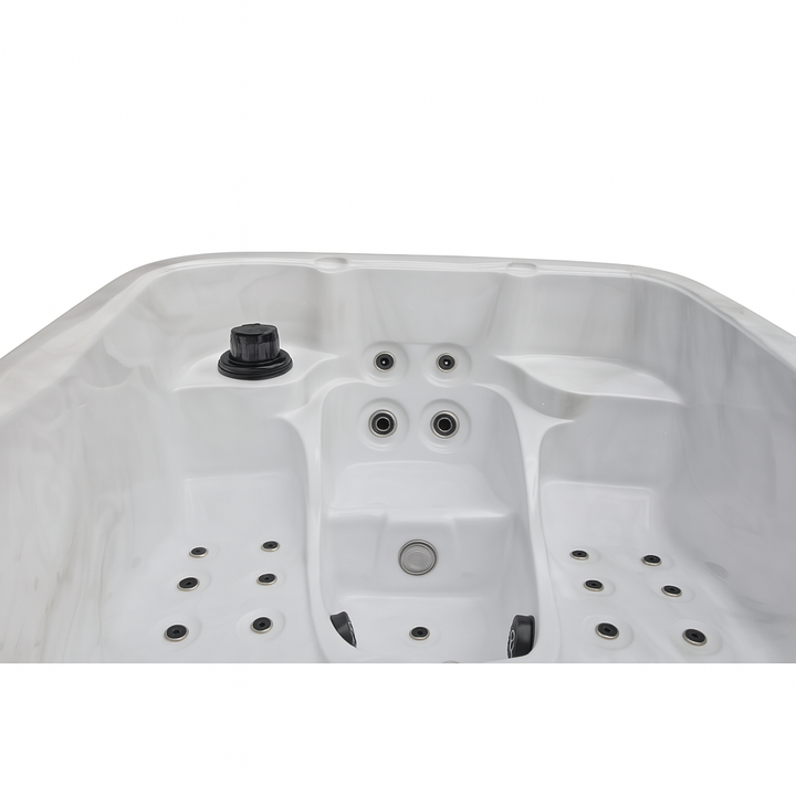 White Largo Studio Series hot tub interior with multiple jet nozzles and ergonomic seating by Luxury Spa