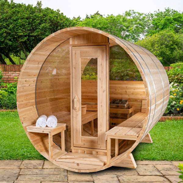 Luxury barrel sauna by Leisurecraft made of wood with glass door and outdoor garden setting