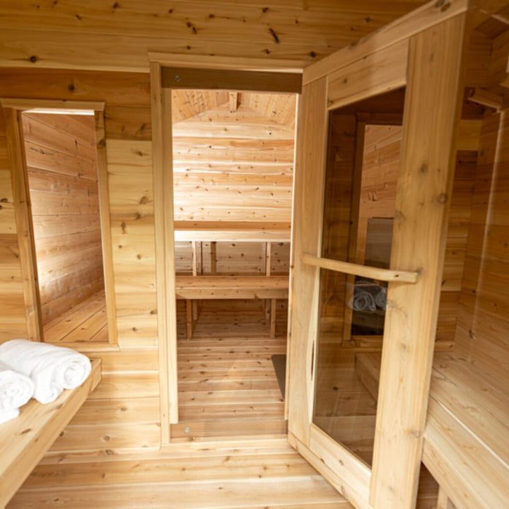 Leisurecraft traditional wood interior luxury cabin sauna with bench seating and glass door