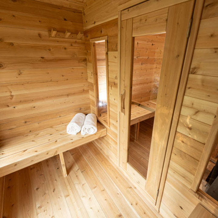 Leisurecraft traditional luxury cabin sauna interior with wooden benches and rolled towels