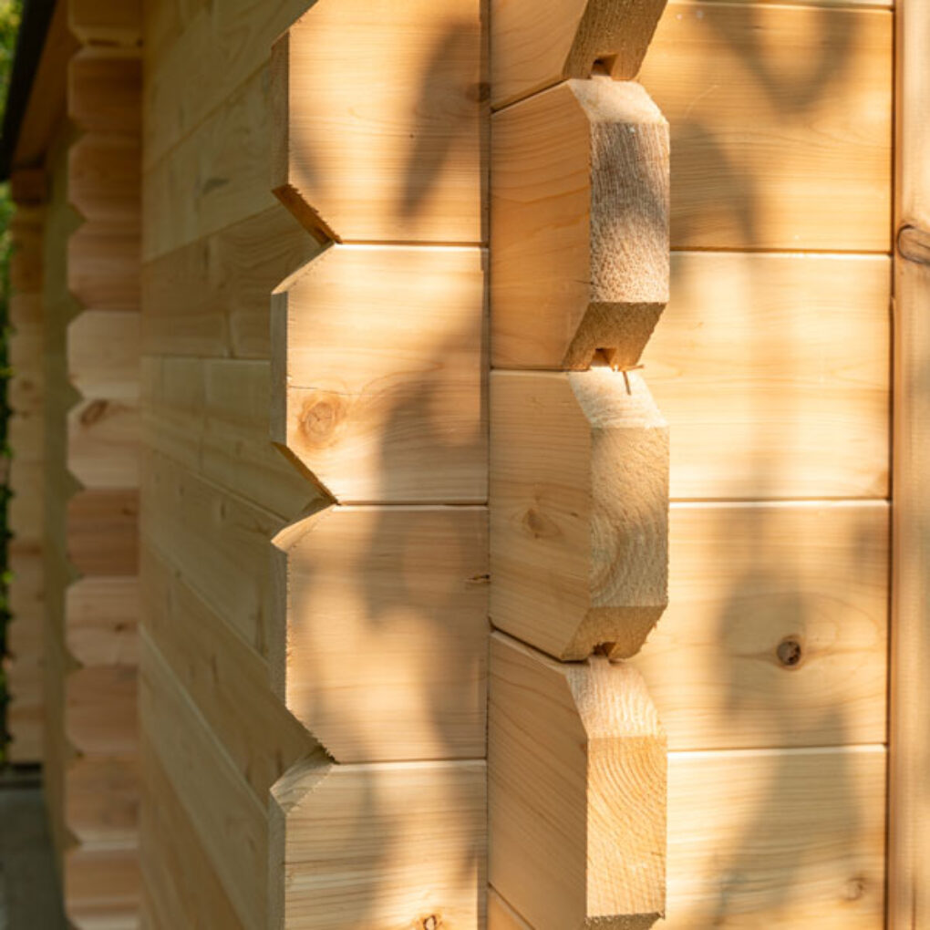 Close-up of wooden corner joints on a Leisurecraft luxury cabin sauna showcasing smooth timber craftsmanship