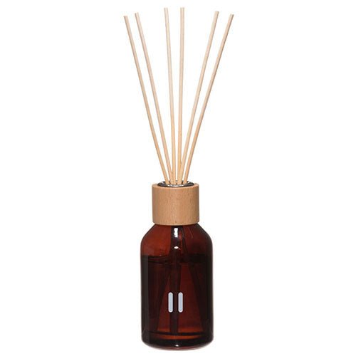Rento luxury fragrance sticks for sauna in an amber glass bottle with wooden cap and reed sticks