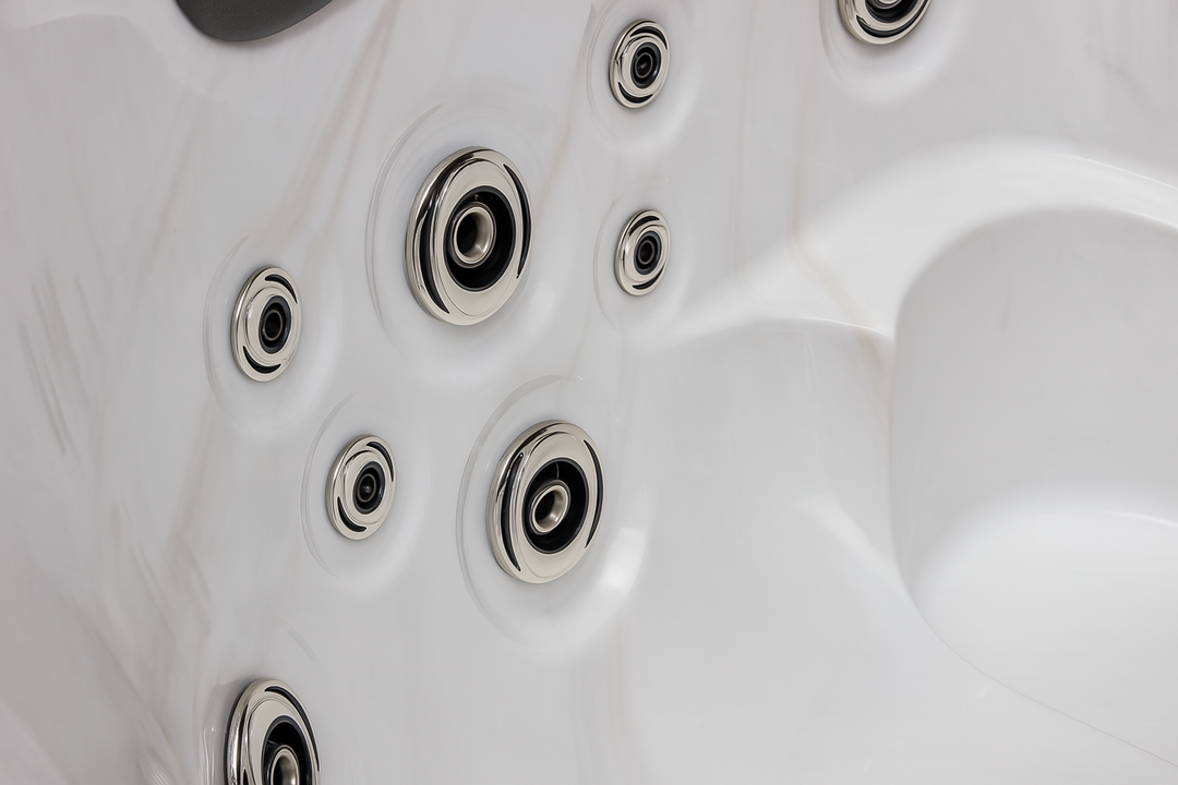 Close-up of chrome jets in a white Luxury Spa luxury hot tub for therapeutic water massage