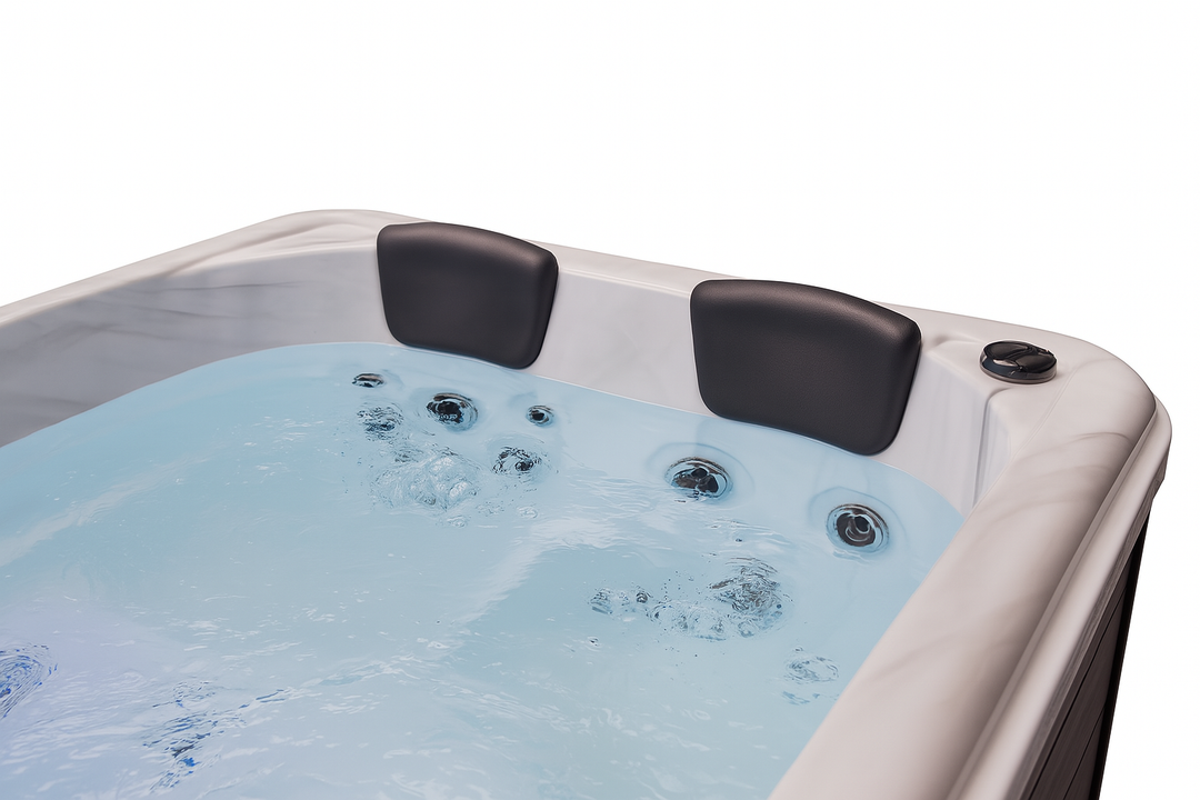 Luxury Spa luxury hot tub with two black headrests and multiple water jets in clear bubbling water