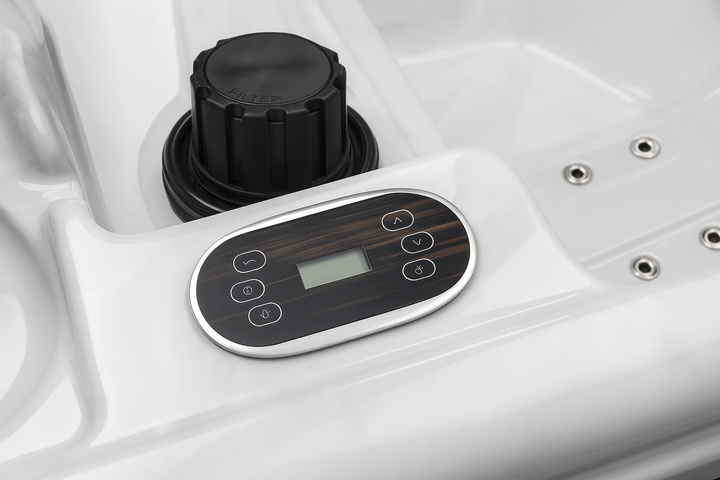 Control panel of a luxury hot tub by Luxury Spa with sleek buttons and digital display