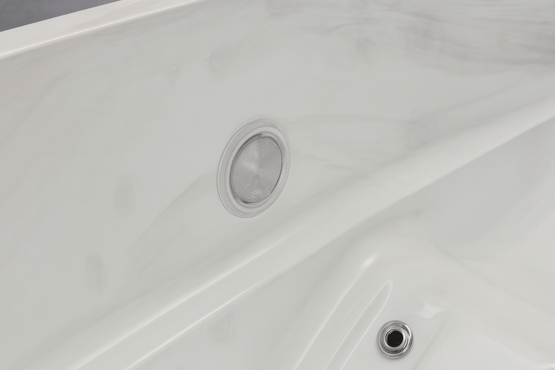 Close-up of jet outlet in a white luxury hot tub with smooth interior design