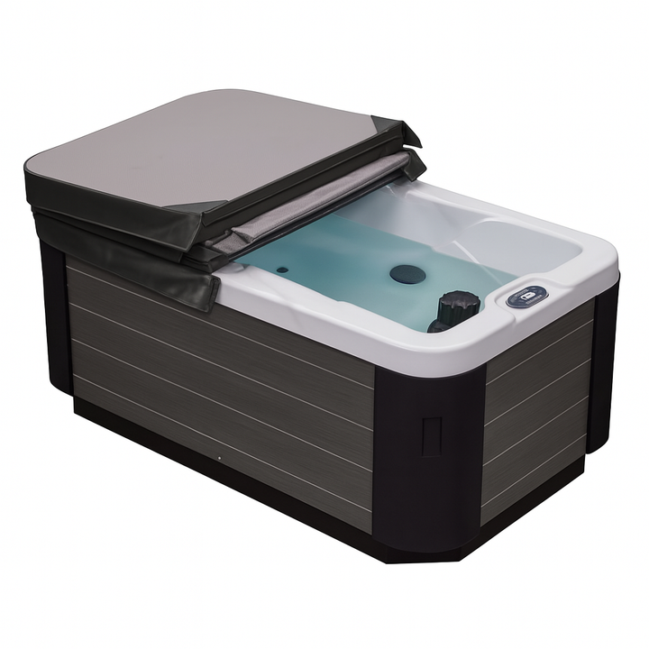 Luxury Spa luxury hot tub for home with gray cover partially open showing water and control panel