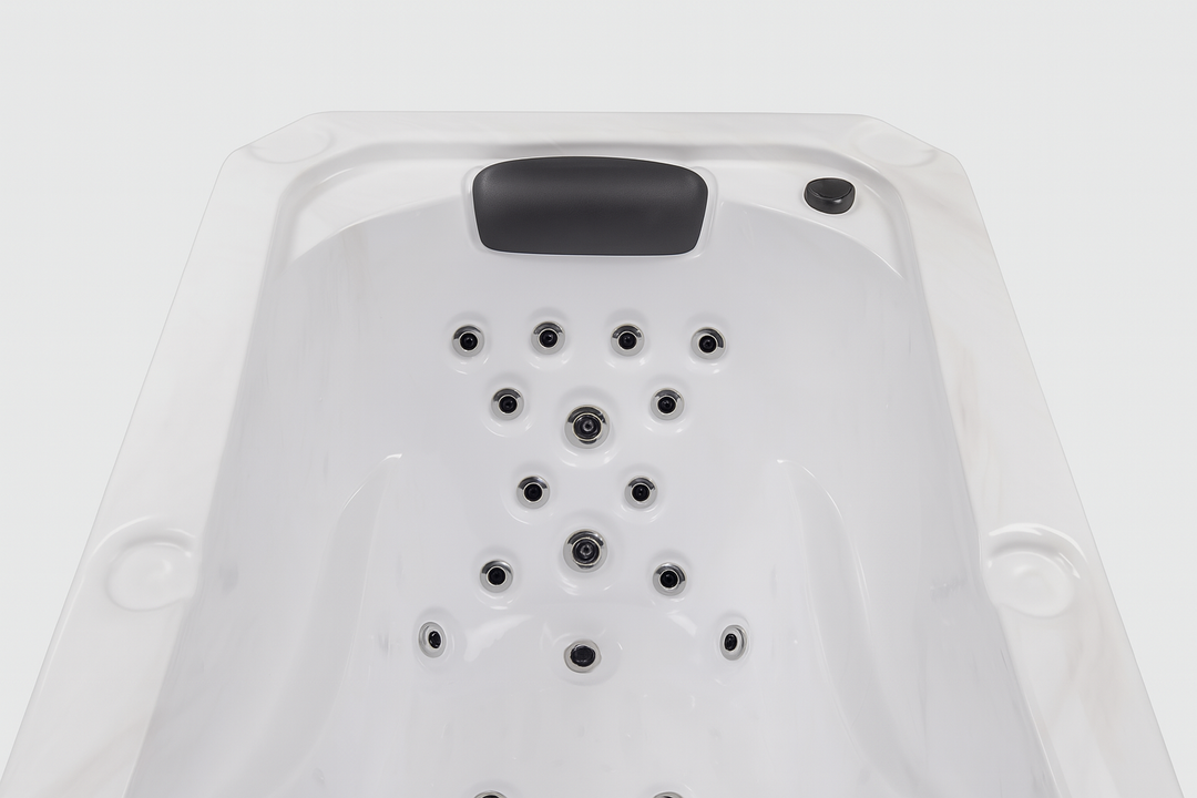 Luxury hot tub for home with multiple water jets and cushioned headrest by Luxury Spa