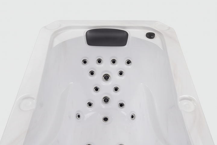 Luxury hot tub for home with multiple water jets and cushioned headrest by Luxury Spa