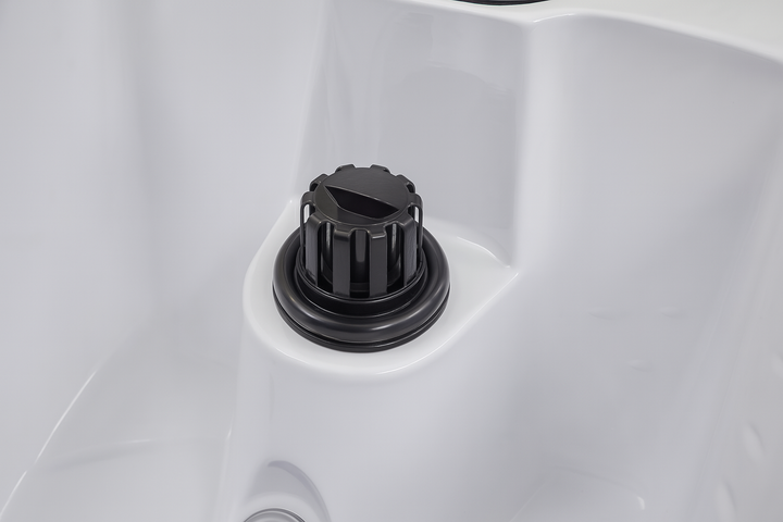 Close-up of black control knob on white luxury hot tub for home by Luxury Spa