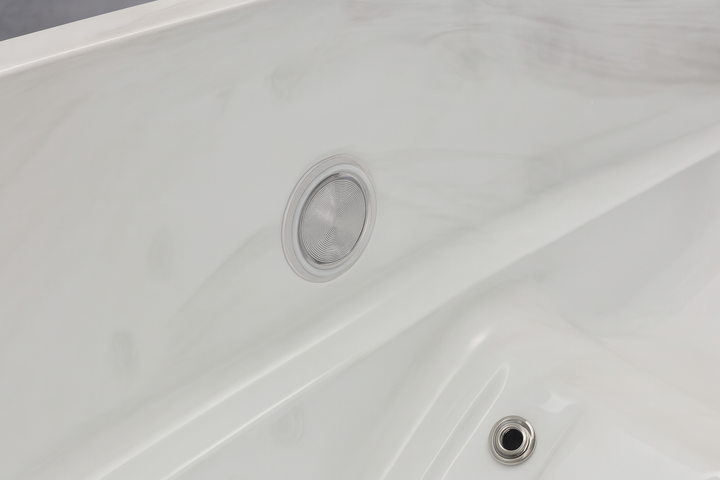 Close-up of a white Luxury Spa luxury hot tub interior showing smooth surface and jets