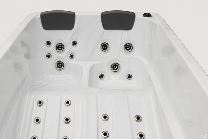 Luxury hot tub by Luxury Spa with multiple jets and two black headrests for comfortable seating