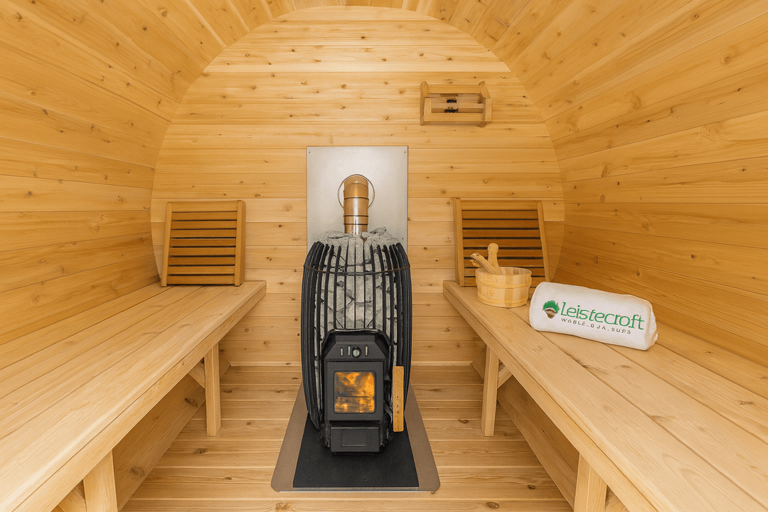 Interior of a Luxury Outdoor Barrel Sauna with wooden benches and a traditional stove
