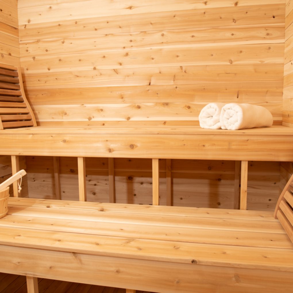 Leisurecraft traditional sauna interior with wooden benches and towels for outdoor luxury sauna experience