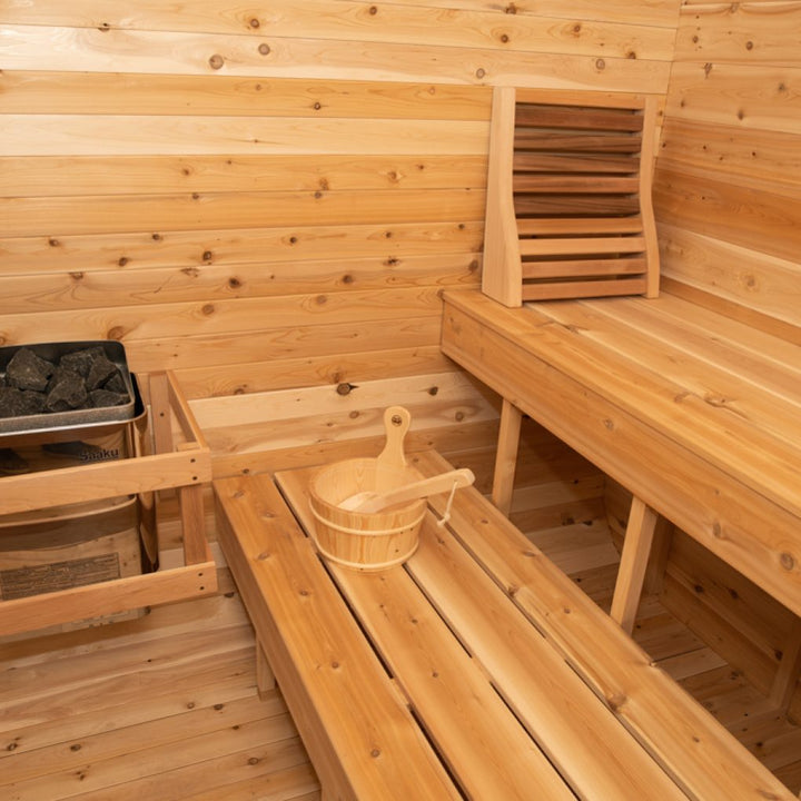 Leisurecraft traditional sauna interior with wooden benches and heater for outdoor luxury sauna experience