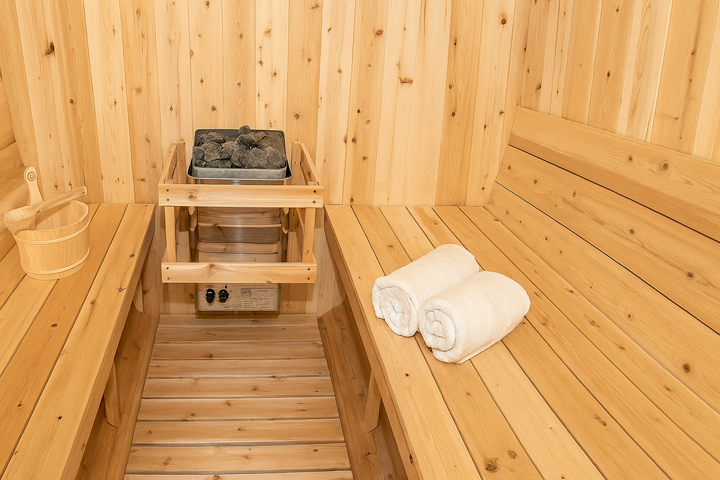 Leisurecraft barrel sauna interior with wooden benches heater and towels in home spa sauna kit