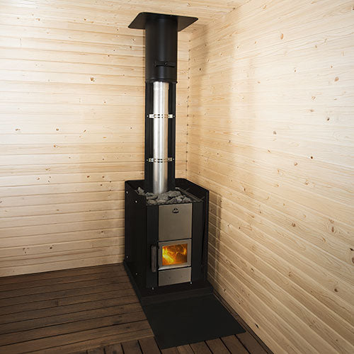 Corner sauna with Narvi Kuru wood-burning sauna stove. Black stove with visible fire, stones on top and stainless flue