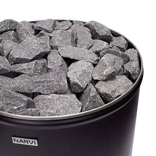 Top view of Narvi Luosto wood-burning sauna stove filled with gray sauna stones on black metal body