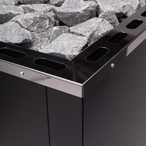 Narvi wood burning sauna stove with durable black metal frame and sauna stones on top