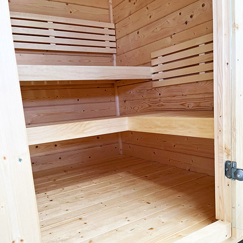 SaunaLife traditional wooden outdoor home sauna kit interior with bench seating and natural wood finish