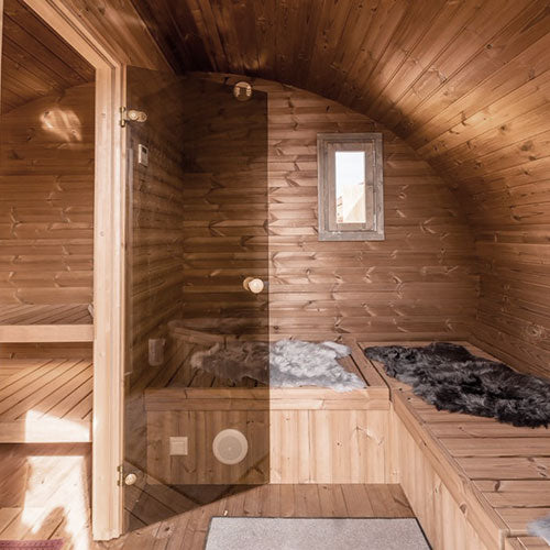 SaunaLife traditional wooden outdoor home sauna kit interior with benches and cozy fur covers