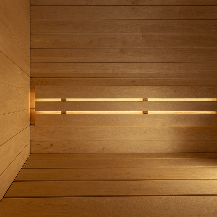 Cozy interior of a SaunaLife outdoor pre-assembled sauna featuring warm wood paneling and soft lighting