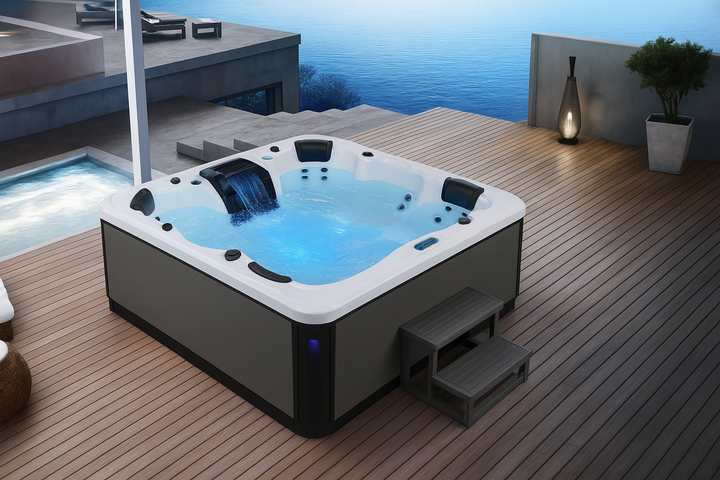Luxury Spa premium outdoor hot tub with waterfall feature and seating on wooden deck by water