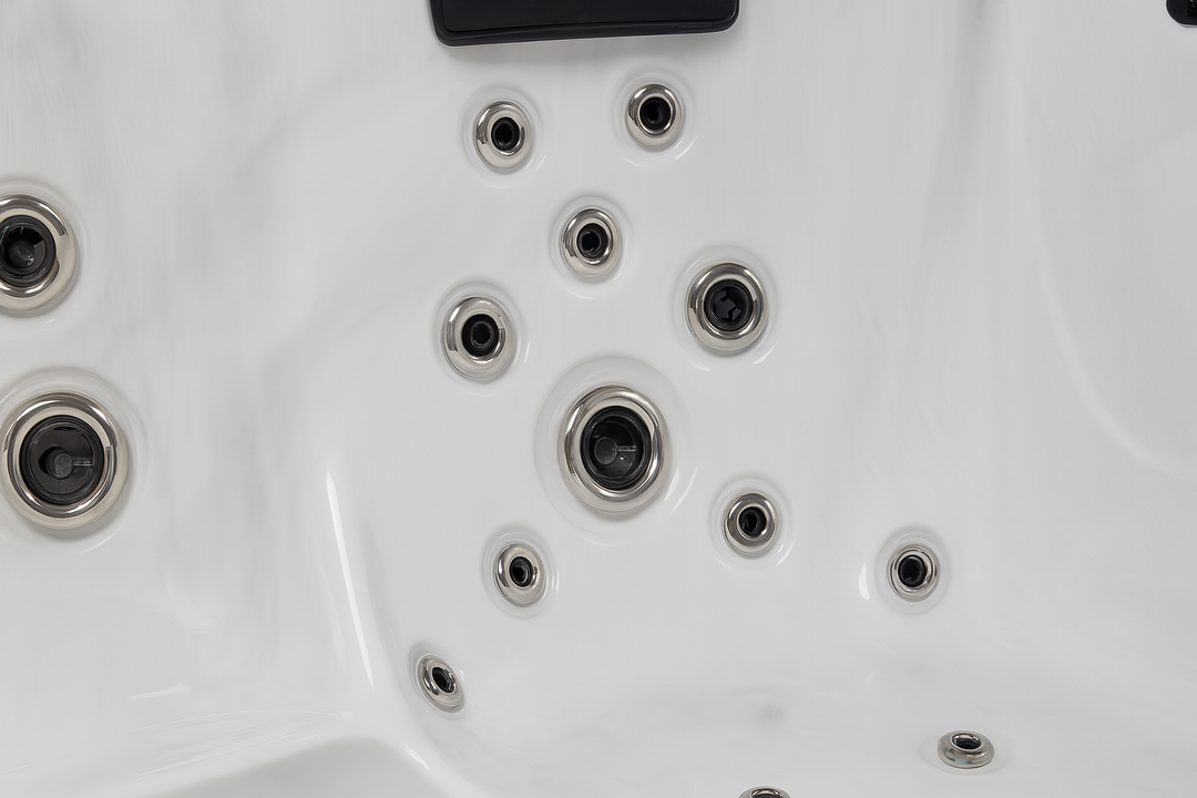 Close-up of white Luxury Spa premium outdoor hot tub interior with multiple jet nozzles