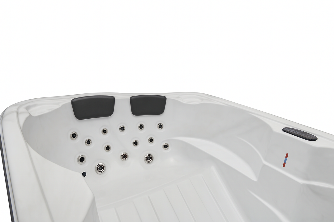 Luxury Spa Regal Studio Series hot tub white interior with multiple jet nozzles and padded headrests