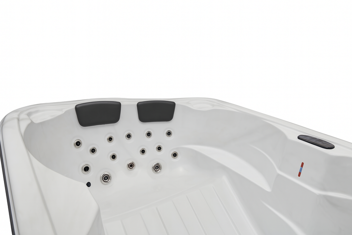 Luxury Spa Regal Studio Series hot tub white interior with multiple jet nozzles and padded headrests