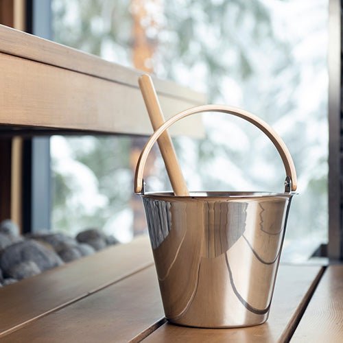 Rento Harri Koskinen sauna bucket in polished stainless steel with wooden ladle for relaxing sauna experiences