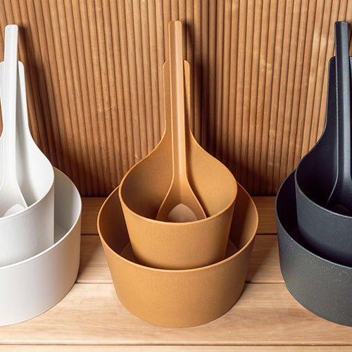 Rento Pisara sauna ladle in various colors stacked with matching bowls for a stylish sauna experience