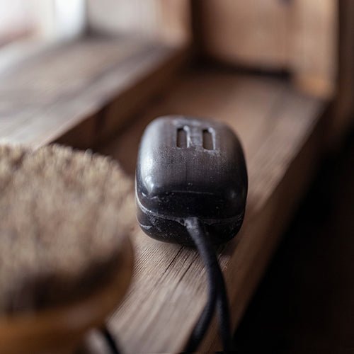 Rento sauna soap bar on a wooden surface, perfect for enhancing your sauna experience