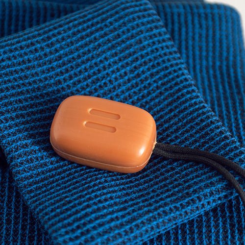 Rento sauna soap bar on a blue towel, ideal for enhancing your sauna experience
