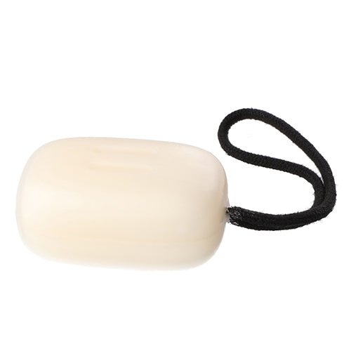 Rento sauna soap bar in a smooth oval shape with a black hanging string for easy use