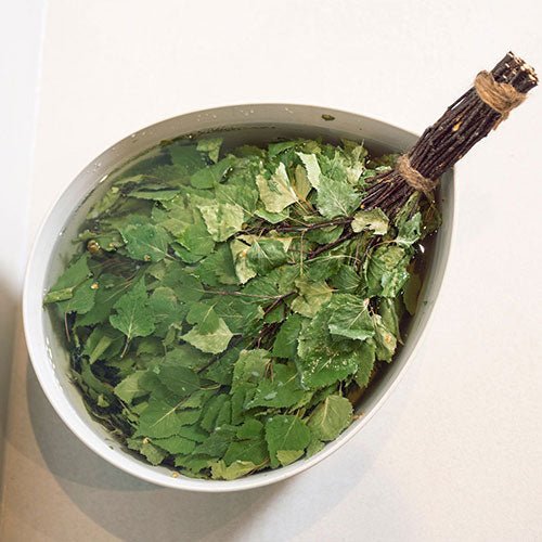Rento sauna whisk made of fresh birch leaves soaked in water for a traditional sauna experience