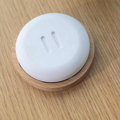 Rento stone diffuser with a sleek design on a wooden surface for essential oil aromatherapy