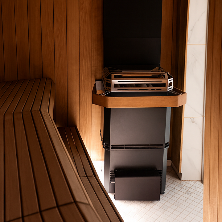 Saunum 13kW sauna heater with climate equalizer installed in a modern wooden sauna interior