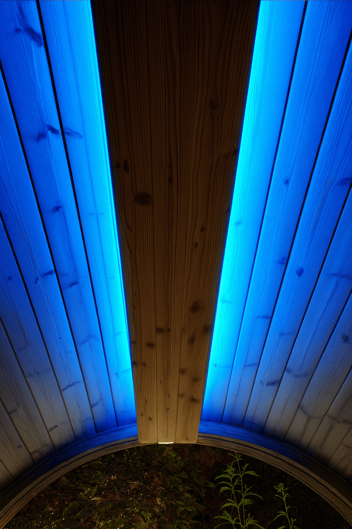 Sauna RGB LED lighting kit showcasing vibrant blue illumination in a wooden sauna interior