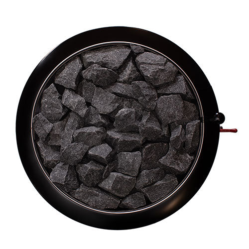 Narvi wood-burning sauna stove top view showing black sauna stones in circular metal frame