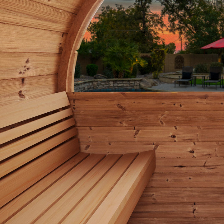 SaunaLife E8W sauna barrel review showing wooden interior bench and curved window with outdoor view