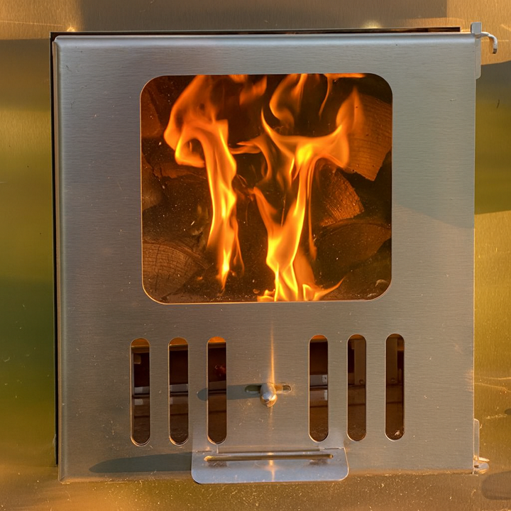 SaunaLife S4N Soak-Series hot tub stainless steel firebox with visible burning flames